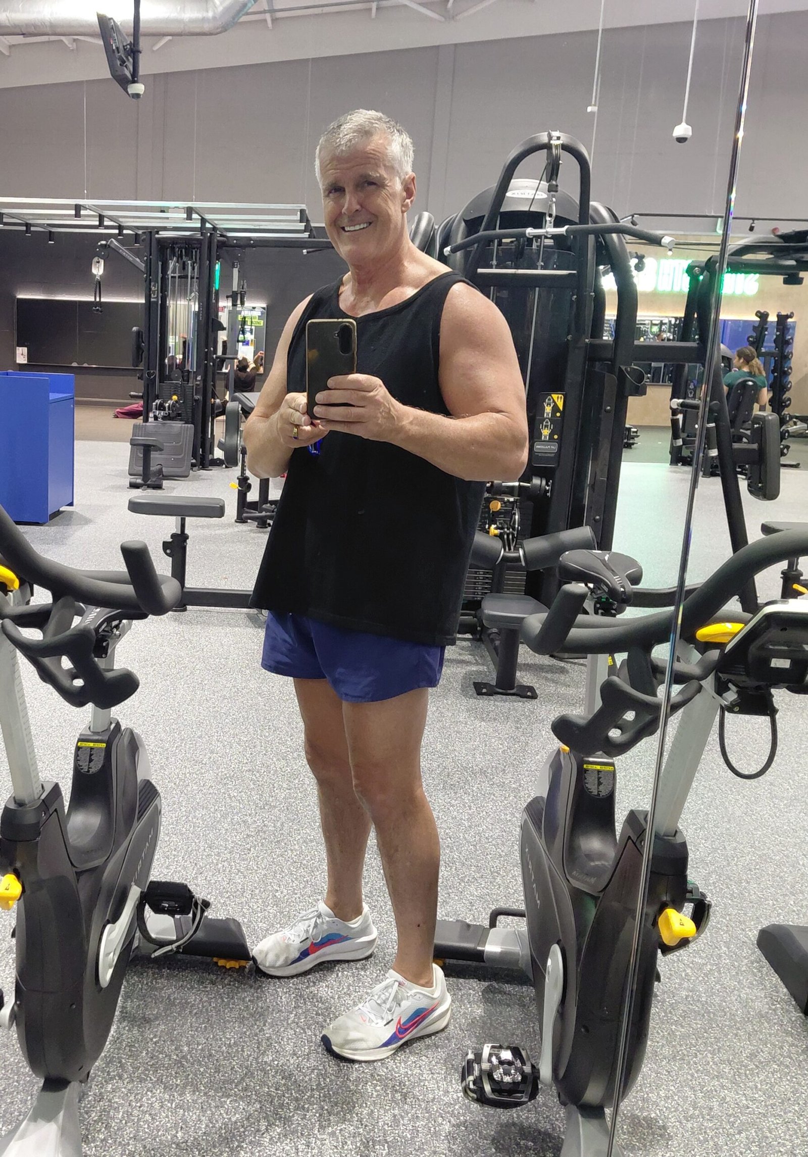 Dominic Pierse wearing a vest and shorts in the gym