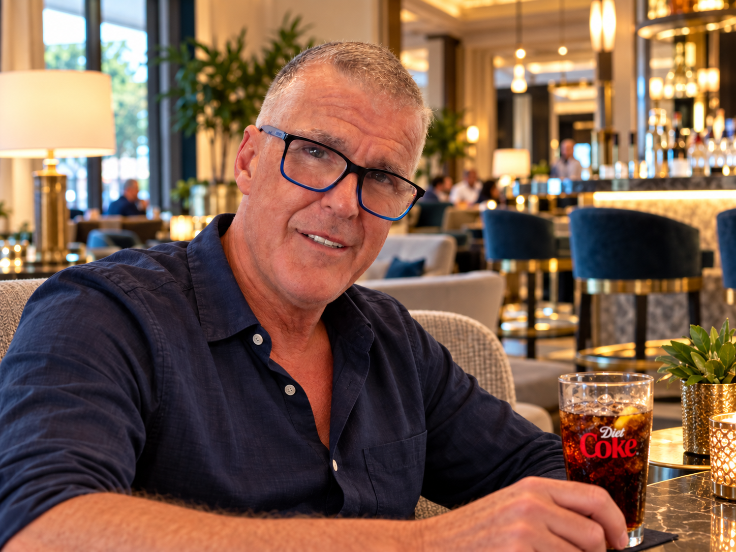 Dominic Pierse seated in a hotel lounge